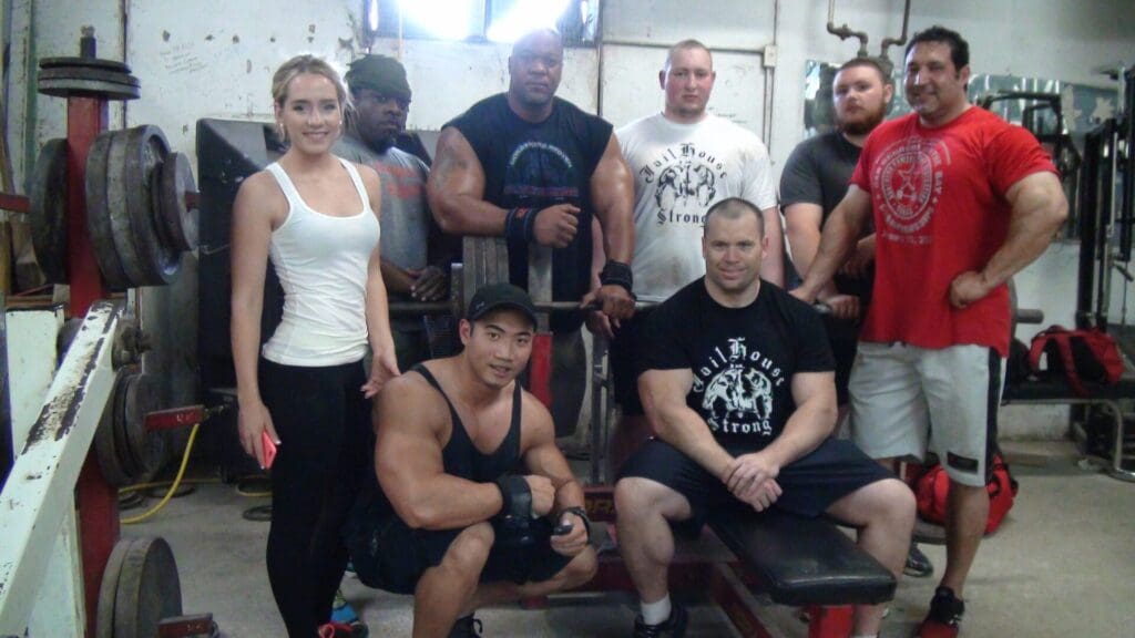 A group of people posing in a gym